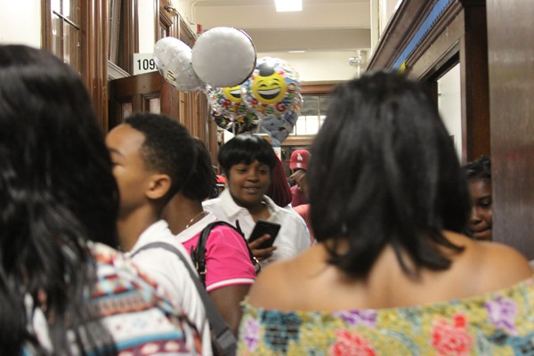 Graduation Scene: Hallways are aflutter with activity